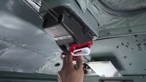 Starting engine of Mi-8 helicopter. Hand switches red lever. Inside helicopter Stock Footage 251566889