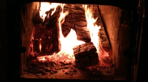 Starting a fire in the fireplace to warm the house Stock Footage 205070531