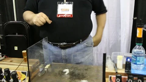 Starting a Fire with a Magnesium Strip at Doomsday Prepper Trade Show Stock Footage 64907405