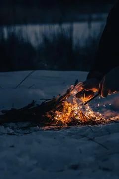 Starting a Fire in the Winter Wilderness Stock Photos