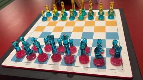 Starting a game of chess chess game glass chess of different colors yellow and Stock Footage 275153672
