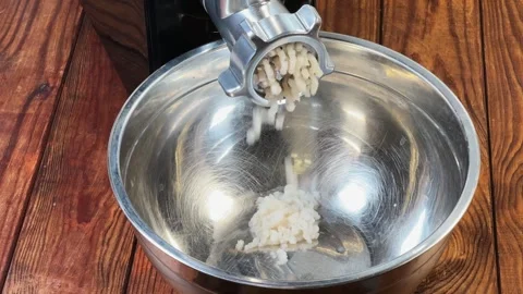 Starting grinding cod into ground fish with electric meat grinder 스톡 동영상 331744447
