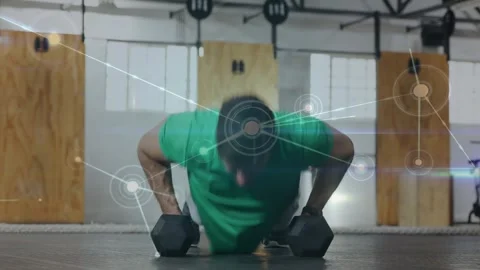 Starting from high plank, man doing pushups, alternating dumbbell rows with HUD Stock Footage 332380745