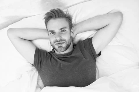 Starting his day with regular routine. Handsome guy awaken for morning routine Stock Photos