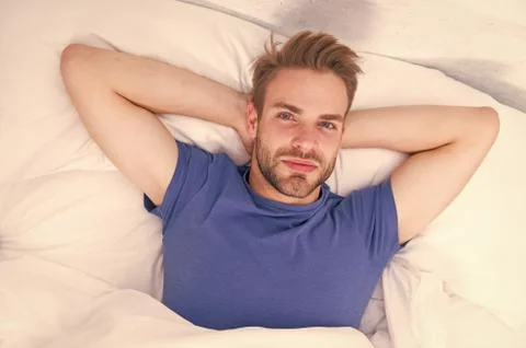 Starting his day with regular routine. Handsome guy awaken for morning routine Stock Photos