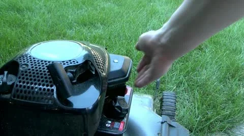 Starting a lawn mower Stock Footage 11142270