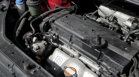 Starting the motor of a compact car - close-up Stock Footage 36814575