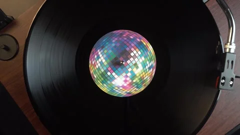 Starting Playback of Vinyl Record With Disco Ball Sticker, Top Down View Stock Footage 335969626