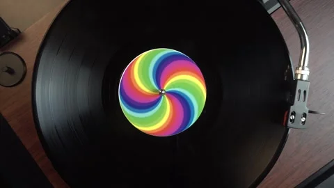 Starting Playback of Vinyl Record With Rainbow Sticker, Top Down View Stock Footage 336259905