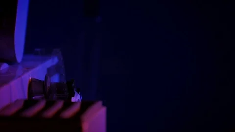Starting up the projector in a dark room. Stock Footage 70833248