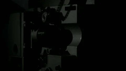 Starting up the projector in a dark room Stock Footage 70842405