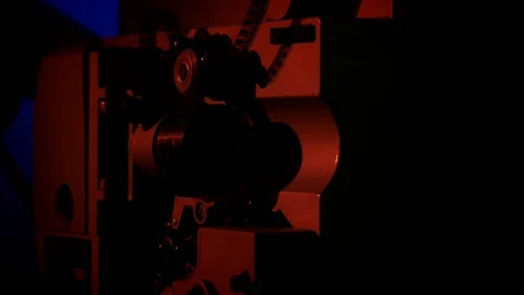 Starting up the projector in a dark room Stock Footage 70842990