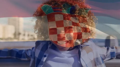 Starting sequence, child leaning at rail, grinning as checkered flag waving over Stock Footage 332544580