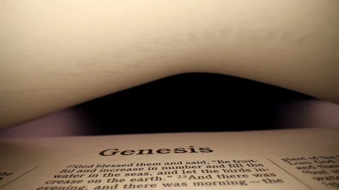 Starting at the top of the page with the book header GENESIS in view, Stock Footage 128745906