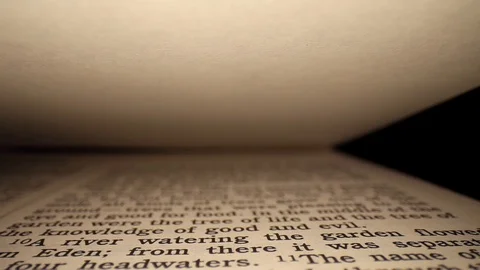 Starting at the verse in Genesis 2:9 "knowledge of good and evil", pulling Stock Footage 129681082