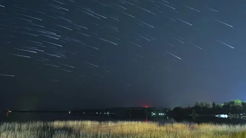 Startrail Time Lapse Over Cottages and Wetlands Stock Footage 245006542