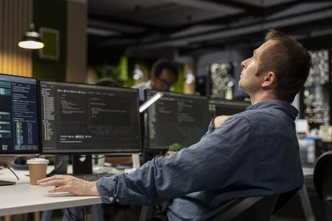 Startup admin thinking how to leverage machine learning tech in office Stock Photos