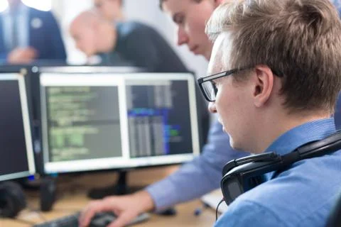 Startup business problem solving. Software developers working on desktop Foto stock