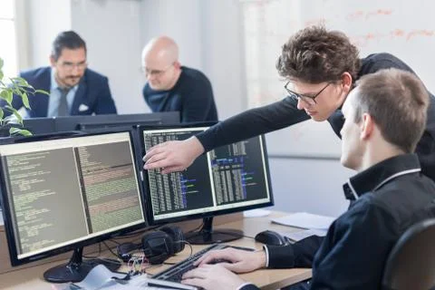 Startup business problem solving. Software developers working on desktop Foto stock