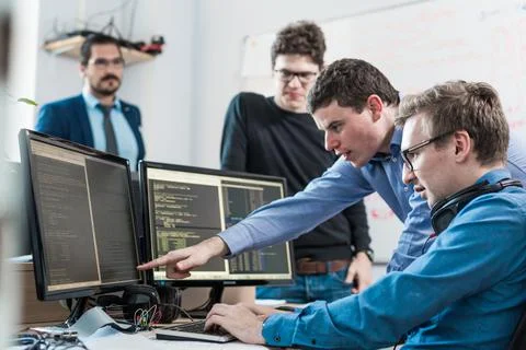 Startup business problem solving. Software developers working on desktop Foto stock