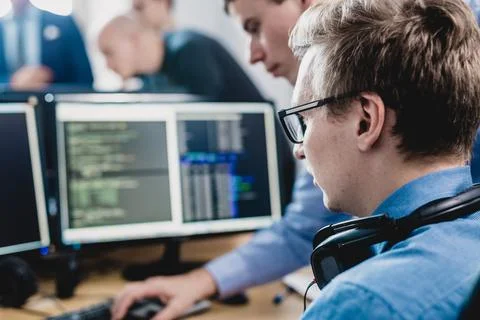 Startup business problem solving. Software developers working on desktop Foto stock