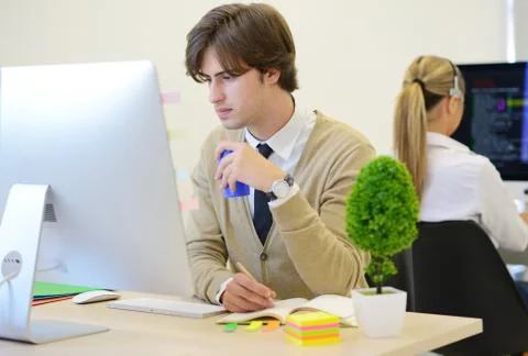 Startup business, software developer with braces working on computer at modern Stockfoto's