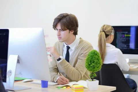 Startup business, software developer working on computer at modern office Stockfoto's