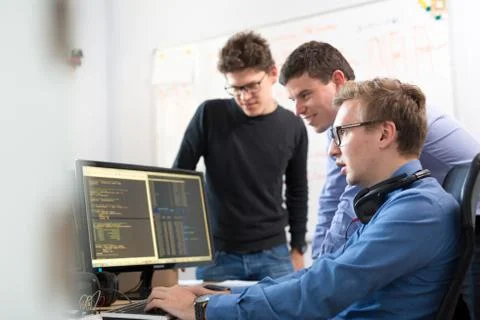 Startup business, software developer working on desktop computer. 스톡 사진