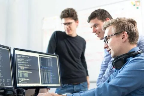 Startup business, software developer working on desktop computer. Startup ... 库存照片