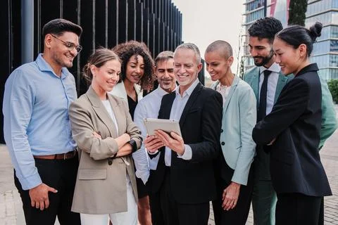 Startup business team talkingand using a tablet to share ideas on a briefing Stock Photos