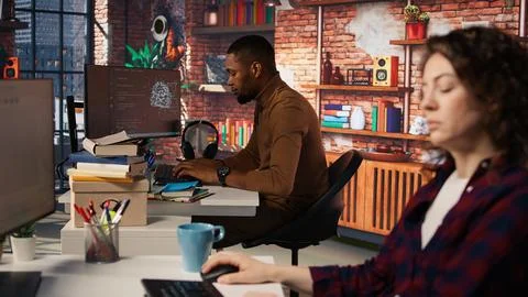Startup company back end developer fixing applications issues Stock Photos