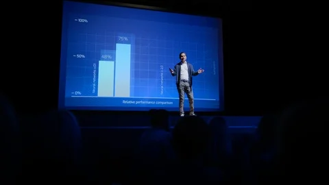 Startup Conference Stage: Speaker Presents New Product, Talks about Performance Stock Footage 122811466