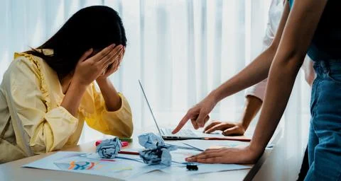 Startup employee experience negative and stressful working environment. Synergic Stock Photos