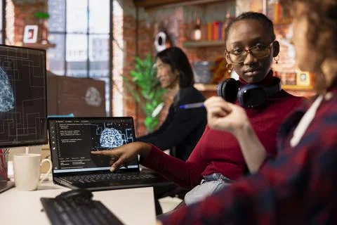 Startup engineers leveraging artificial intelligence tech in workspace 스톡 사진