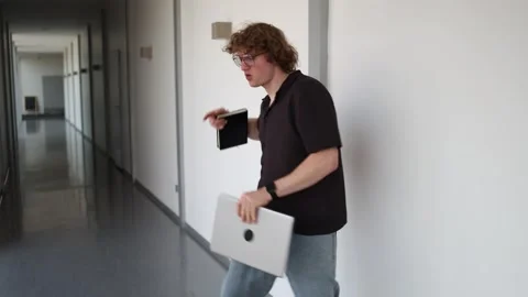 Startup founder celebrates success while walking Stock Footage 338277183