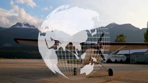 On startup grid globe emerging above parked propeller plane rotating eastward to Stock Footage 311084638
