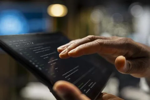 Startup manager looks at code written by workers, thinking how to leverage it Stockfoto's