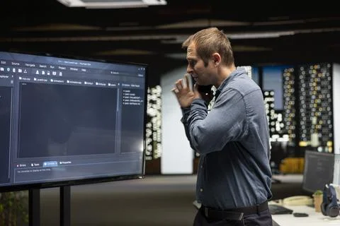 Startup manager looks at code written by workers, thinking how to leverage it Stockfoto's
