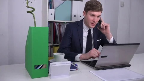 Startup modern office male executive talking on phone calling business clients Stock Footage