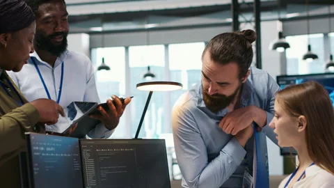 Startup newcomer making friends in office, learning how to use machine learning Stock Footage 313016562