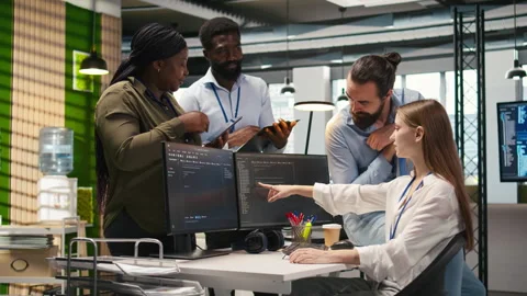 Startup newcomer making friends in office, learning how to use machine learning Stock Footage 313166982