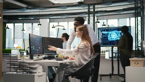 Startup office manager congratulates young girl after developing AI models Stock Footage 313168326