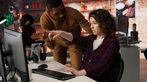 Startup office supervisor checking up on IT expert using artificial intelligence 写真素材