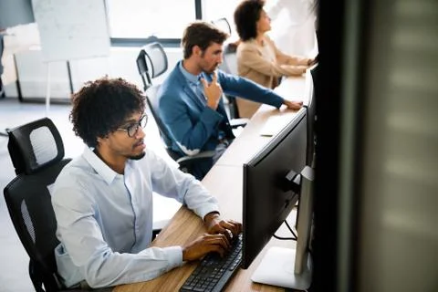 Startup programmer people group working everyday job at modern office Stock-Fotos