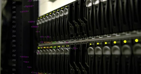 At startup server rack blinking LEDs showing HTML code scrolling to showcase Stock Footage 313704400