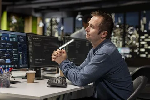 Startup software developer writing code on PC, leveraging AI tech Photos