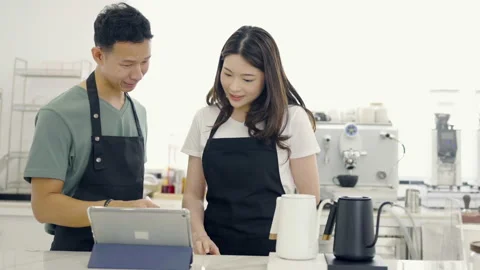 Startup successful small business owner sme boy girl stand with tablet. Stock Footage 219861482