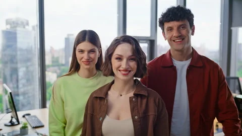 Startup team posing camera in panoramic windows office portrait. Business people Stock Footage 319751448