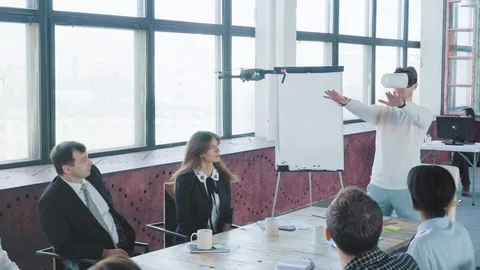 The startup team is testing a new technology - managing the drone through Stock Footage 108183956