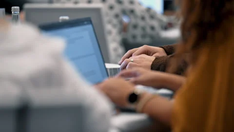 Startup team working together on laptops in meeting Stock Footage 332211975